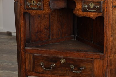 Lot 1530 - AN 18TH CENTURY STYLE WELSH OAK STANDING CORNER CUPBOARD