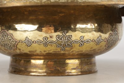 Lot 776 - A 19TH CENTURY ISLAMIC BRASS AND SILVER INLAID WASH BASIN WITH CENTRAL PIERCED STRAINER