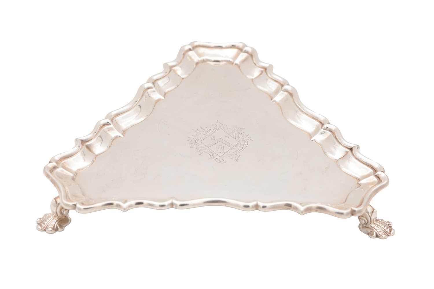 Lot 99 - A GEORGE II ENGLISH SILVER TRIANGULAR SALVER BY HUGH MILLS, LONDON