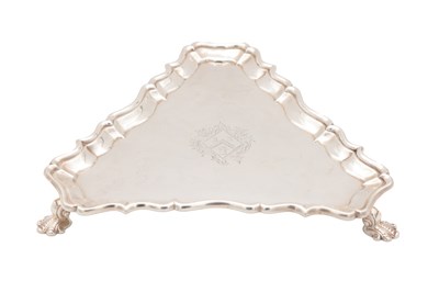 Lot 99 - A GEORGE II ENGLISH SILVER TRIANGULAR SALVER BY HUGH MILLS, LONDON