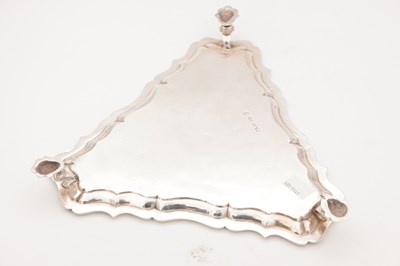 Lot 99 - A GEORGE II ENGLISH SILVER TRIANGULAR SALVER BY HUGH MILLS, LONDON