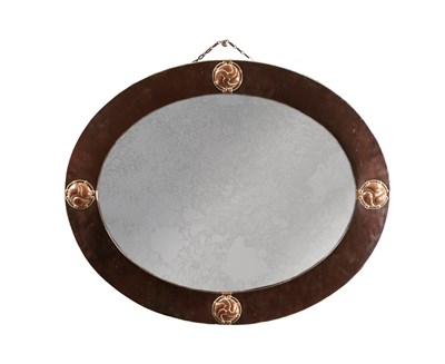 Lot 1133 - ATT. LIBERTY & CO. AN ARTS AND CRAFTS COPPER OVAL MIRROR