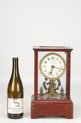 Lot 1365 - EUREKA CLOCK CO. LTD., LONDON AN EARLY 20TH CENTURY ENGLISH MAHOGANY FIVE GLASS 1000 DAY ELECTRIC MANTEL CLOCK