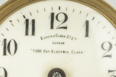 Lot 1365 - EUREKA CLOCK CO. LTD., LONDON AN EARLY 20TH CENTURY ENGLISH MAHOGANY FIVE GLASS 1000 DAY ELECTRIC MANTEL CLOCK
