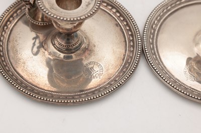 Lot 67 - A PAIR OF VICTORIAN ENGLISH SILVER CHAMBERSTICKS WITH CONICAL SNUFFERS