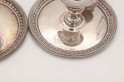 Lot 67 - A PAIR OF VICTORIAN ENGLISH SILVER CHAMBERSTICKS WITH CONICAL SNUFFERS