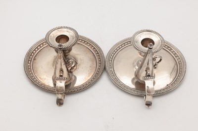 Lot 67 - A PAIR OF VICTORIAN ENGLISH SILVER CHAMBERSTICKS WITH CONICAL SNUFFERS