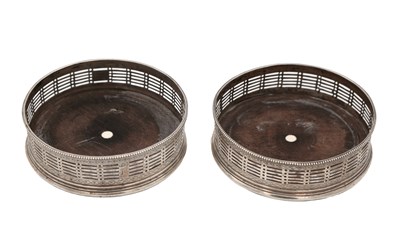 Lot 15 - A PAIR OF GEORGE III ENGLISH SILVER WINE COASTERS