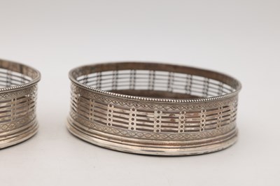 Lot 15 - A PAIR OF GEORGE III ENGLISH SILVER WINE COASTERS