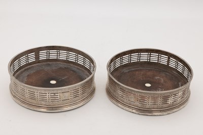 Lot 15 - A PAIR OF GEORGE III ENGLISH SILVER WINE COASTERS