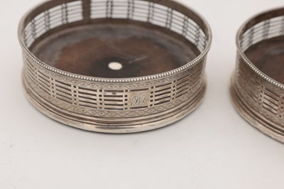 Lot 15 - A PAIR OF GEORGE III ENGLISH SILVER WINE COASTERS
