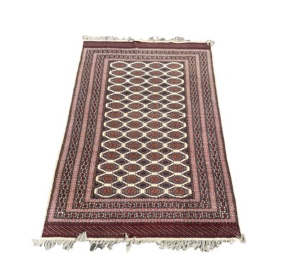 Lot 991 - A BOKHARA WOOL CARPET