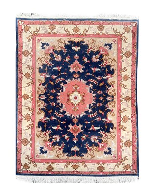 Lot 1109 - AN IRANIAN HAND-KNOTTED WOOL AND SILK CARPET