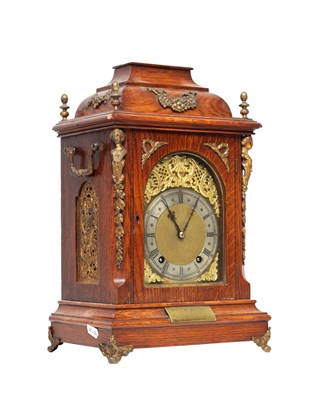 Lot 1325 - A LATE 19TH CENTURY GERMAN OAK AND ORMOLU MOUNTED QUARTER CHIMING BRACKET CLOCK