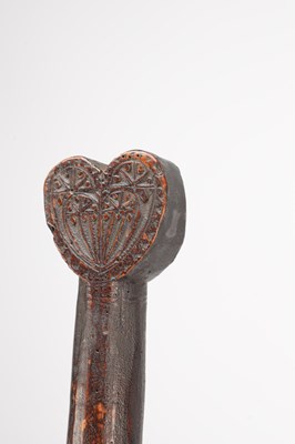 Lot 1385 - AN EARLY 17TH CENTURY WELSH CARVED WOOD LOVE TOKEN WASHING BAT