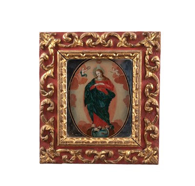 Lot 1039 - A 17TH CENTURY ITALIAN REVERSE PAINTED GLASS DEVOTIONAL PICTURE IN A LEAF CARVED FRAME
