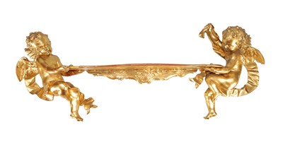 Lot 1623 - A 19TH CENTURY FRENCH CARVED GILT WOOD HANGING SHELF WITH TWIN WINGED PUTTI SUPPORTS