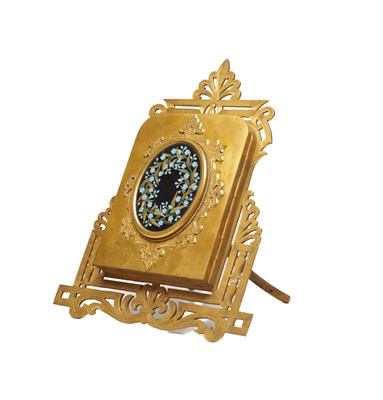 Lot 1127 - A 19TH CENTURY VICTORIAN BRASS PHOTOGRAPH FRAME WITH PIETRA DURA PLAQUE ON A PIERCED EASEL