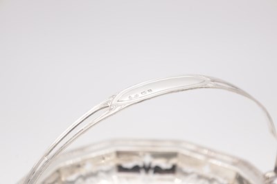 Lot 105 - A GEORGE V ENGLISH SILVER SWING-HANDLED BASKET