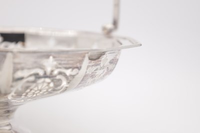 Lot 105 - A GEORGE V ENGLISH SILVER SWING-HANDLED BASKET