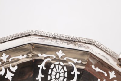 Lot 105 - A GEORGE V ENGLISH SILVER SWING-HANDLED BASKET