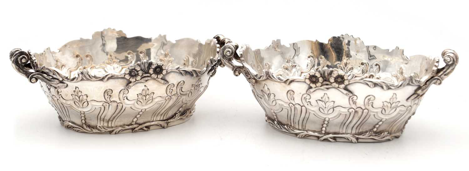 Lot 115 - A PAIR OF EDWARDIAN ENGLISH SILVER TWO-HANDLED BASKETS