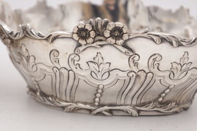 Lot 115 - A PAIR OF EDWARDIAN ENGLISH SILVER TWO-HANDLED BASKETS