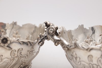 Lot 115 - A PAIR OF EDWARDIAN ENGLISH SILVER TWO-HANDLED BASKETS