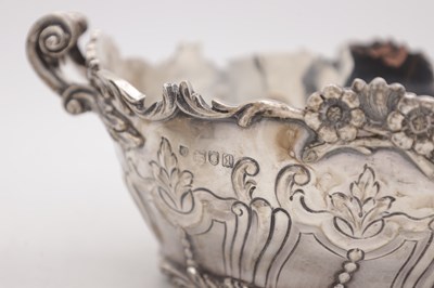 Lot 115 - A PAIR OF EDWARDIAN ENGLISH SILVER TWO-HANDLED BASKETS