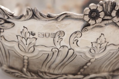 Lot 115 - A PAIR OF EDWARDIAN ENGLISH SILVER TWO-HANDLED BASKETS