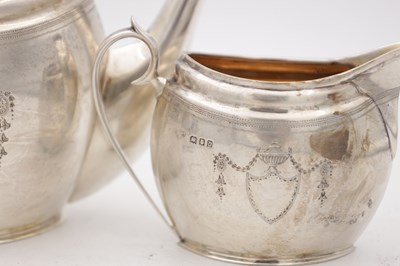Lot 110 - A GEORGE V ENGLISH SILVER THREE PIECE TEA SET