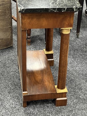 Lot 1489 - A PAIR OF EARLY 19TH CENTURY FRENCH ORMOLU MOUNTED MAHOGANY CONSOLE TABLES