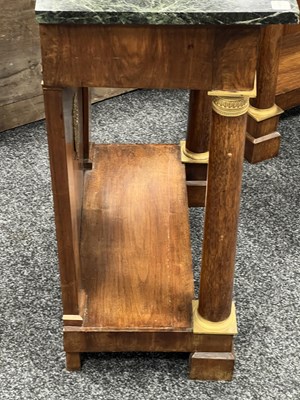 Lot 1489 - A PAIR OF EARLY 19TH CENTURY FRENCH ORMOLU MOUNTED MAHOGANY CONSOLE TABLES