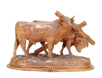 Lot 1400 - ATT JOHANN HUGLER A SWISS BLACK FOREST CARVED WOOD GROUP OF YOKED OXEN ON OVAL BASE