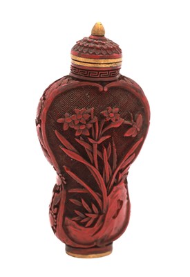 Lot 743 - AN EARLY 19TH CENTURY CHINESE CARVED CINNABAR SNUFF BOTTLE
