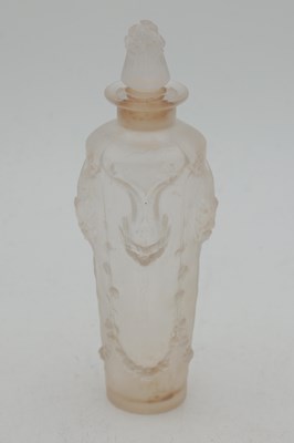 Lot 562 - RENE LALIQUE A FROSTED GLASS 'PAN' PERFUME BOTTLE AND STOPPER