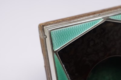 Lot 61 - AN ART DECO ENGLISH SILVER MOUNTED TORTOISESHELL AND GUILLOCHE ENAMEL POCKET WATCH HOLDER