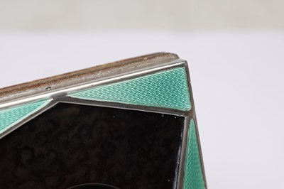 Lot 61 - AN ART DECO ENGLISH SILVER MOUNTED TORTOISESHELL AND GUILLOCHE ENAMEL POCKET WATCH HOLDER