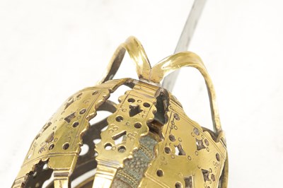 Lot 842 - AN 18TH CENTURY SCOTTISH BRASS HILTED BASKET-HILT SWORD