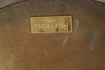 Lot 1561 - A PAIR OF BRONZED METAL SIDE TABLES WITH RITZ HOTEL PLAQUES TO THE UNDERSIDE
