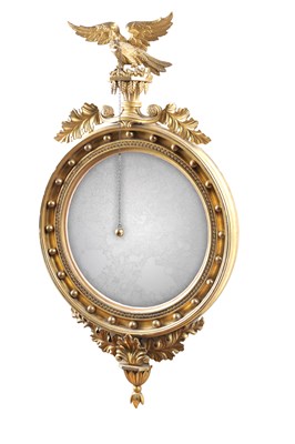 Lot 1592 - A REGENCY GILTWOOD CONVEX MIRROR