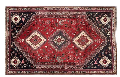 Lot 1162 - A PERSIAN WOOL CARPET WITH TRIPLE MEDALLION AND ANIMAL MOTIFS