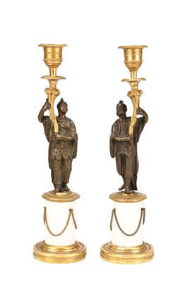 Lot A PAIR OF REGENCY BRONZE AND PORCELAIN FIGURAL CANDLESTICKS