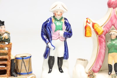 Lot A COLLECTION OF TEN 19TH CENTURY POTTERY FIGURES OF NAPOLEON BONAPARTE