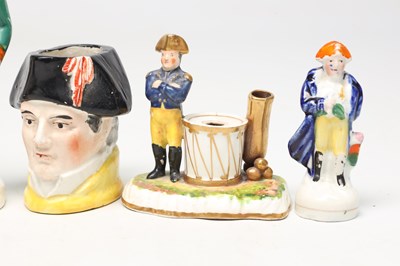 Lot A COLLECTION OF TEN 19TH CENTURY POTTERY FIGURES OF NAPOLEON BONAPARTE