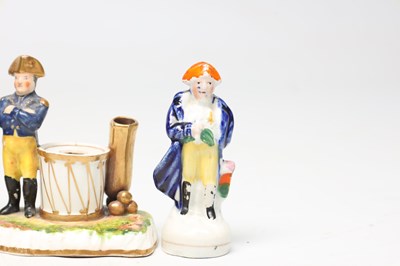 Lot A COLLECTION OF TEN 19TH CENTURY POTTERY FIGURES OF NAPOLEON BONAPARTE