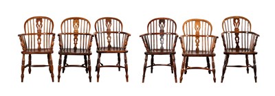Lot A SET OF SIX MATCHED 19TH CENTURY ASH AND ELM LOW-BACK WINDSOR ARMCHAIRS