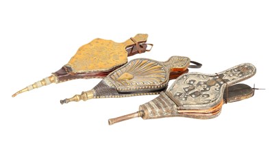 Lot A COLLECTION OF THREE 19TH CENTURY LEATHER AND METAL MOUNTED FIRE BELLOWS