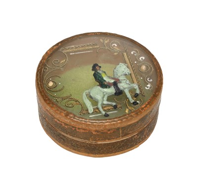 Lot A 19TH CENTURY FRENCH PAPIER MACHE SNUFF BOX WITH DOMED GLAZED COVER ENCLOSING AN EQUESTRIAN FIGURE