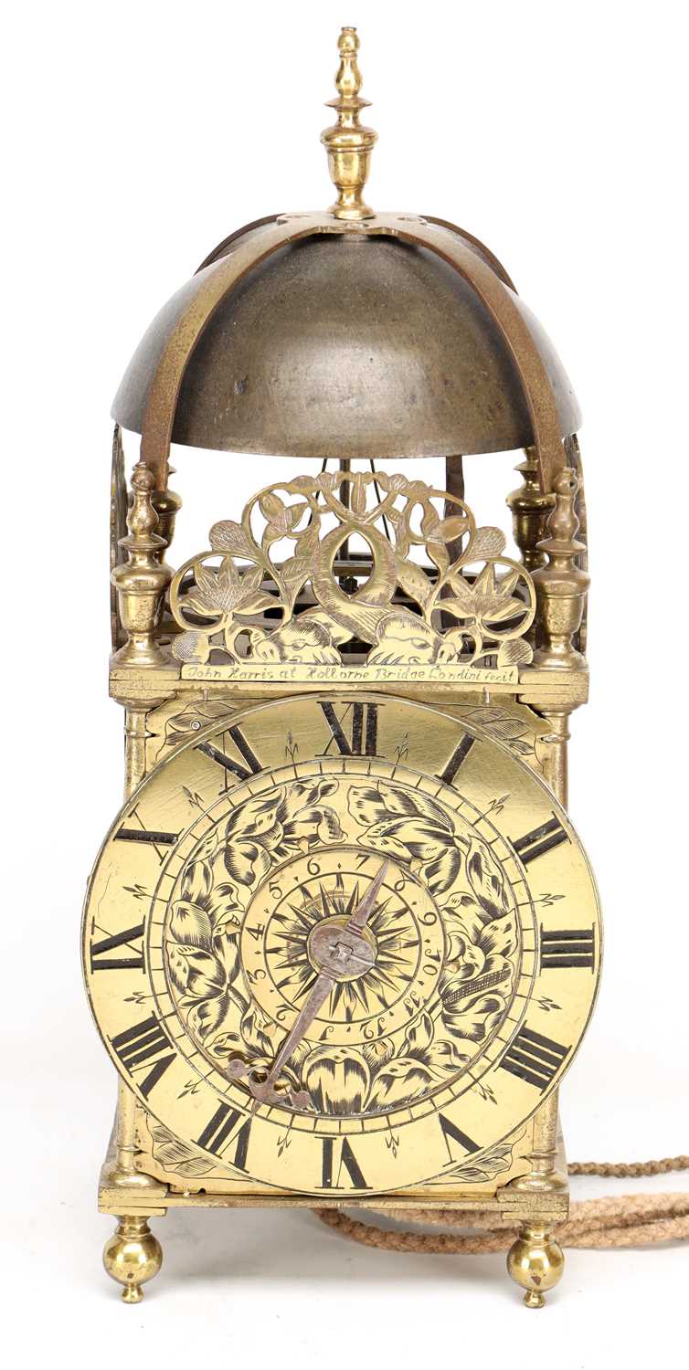 Lot JOHN HARRIS, LONDON. A CHARLES II BRASS STRIKING LANTERN CLOCK WITH BALANCE WHEEL VERGE ESCAPEMENT
